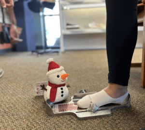 Snowman measuring foot