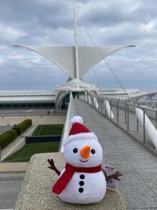 Snowman in front of museum